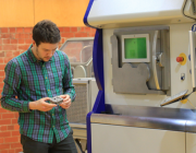 RMIT researcher Dr Alexander Medvedev examines an additive manufactured ballistic target.