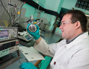 Defence Civilian Dr David Evans, Senior Chemistry Scientist from the Engines and Fuels Integrity department, prepares to calibrate a machine prior to testing in the Fuel and Lubricants Laboratory at the Defence Science and Technology Group facility, Fishermans Bend, Melbourne.