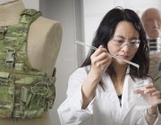 Jie Ding examines electrolyte material that can function as both battery component and body armour. Jie Ding examines electrolyte material that can function as both battery component and body armour.
