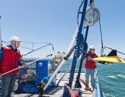 Defence researcher Phil Jackson (left) and colleague Bradyn Gray retrieve a TAPS tow-body during a trial in South Australia's Spencer Gulf. TAPS