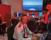 DST researchers working alongside Navy personnel in the Combat System Integration Laboratory, exploring UAS integration into RAN ships.