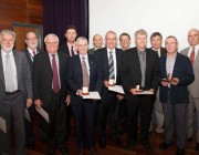 Bruce Ward, Gordon Frazer, Justin Praschifka, Don Sinnott, Malcolm Golley, Minister for Defence Science and Personnel Warren Snowdon. Front row: Warwick Kemp, Gordon Brimble, Steve Sheedy, Neil Bryans, Mike Turley, Stuart Anderson with their awards