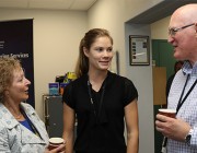 R&I Graduate Monique Hollick (middle) talking with DST Chiefs Dr Janis Cocking and Dr John Riley.