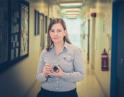 Tania Holmes with one of the high-tech cameras used to capture explosive action. 