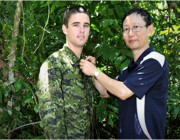 A camouflage uniform is tested by a DSTO scientist.