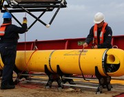 Chris Minor secures the Phoenix International Autonomous Underwater Vehicle (AUV) Artemis after the AUV completed the final mission prior to ADV Ocean Shield's return to port for replenishment during the seabed search for missing Malaysia Airlines flight MH 370. 