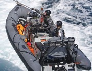 HMAS Choules sea boat being hoisted from the water. A photo of an HMAS Choules sea boat being hoisted from the water.