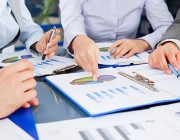 DSTO's first National Security Science and Technology Workshop took place on 27 November in Canberra. Stock image of hands pointing at documents.