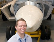 Dr Andrew Walters standing in front of DSTO's 'Iron Bird'