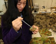 Dr Jie Ding tests how a soldier’s uniform reacts to the application of Newtonian liquids. Defence reseracher Dr Jie Ding.