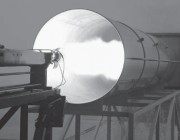 A photograph of a static firing in DST Group's rocket motor test facility.