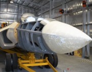 An aircraft being worked on in a hangar.