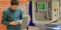 RMIT researcher Dr Alexander Medvedev examines an additive manufactured ballistic target.