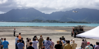 POST 2024 attendees observe a remotely piloted demonstration at Marine Corps Air Station Kaneohe Bay, Hawaii. This was part of the U.S. Indo-Pacific Command's 2024 POST Field Experimentation (POST-FX) conference which brought the region's science, technology and security experts together for field demonstrations, allowing providers to showcase technologies that engage U.S. Indo-Pacific allies and partners.