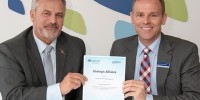 Chief Defence Scientist Dr Alex Zelinsky (left) and Airbus Group Australia Pacific Managing Director Dr Jens Goennemann (right) holding the newly signed strategic alliance.