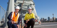 Image of Dr Andrew Ang and Mr Matthew Leigh preparing for the on-board trials on HMAS Canberra.