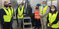 Mr Nicholas Brealey, DSTG; Assoc Prof. Russel Brinkworth, Flinders; Mr Myles Adams, Honours student, Flinders; Dr Andrew Lammas, Flinders; Mr Ashley Johns, Supashock; Prof Karl Sammut, Flinders; Mr Oscar Fiorinotto, Founder & CEO, Supashock; and Prof Giselle Rampersad, Flinders with the shock absorber rig.