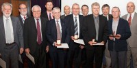 Bruce Ward, Gordon Frazer, Justin Praschifka, Don Sinnott, Malcolm Golley, Minister for Defence Science and Personnel Warren Snowdon. Front row: Warwick Kemp, Gordon Brimble, Steve Sheedy, Neil Bryans, Mike Turley, Stuart Anderson with their awards