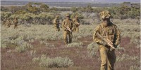 Members from the 1st Brigade, Australian Army, on patrol during Exercise Boars Run at Cultana Training Area. 
