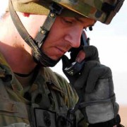 A soldier speaking on a wireless telephone